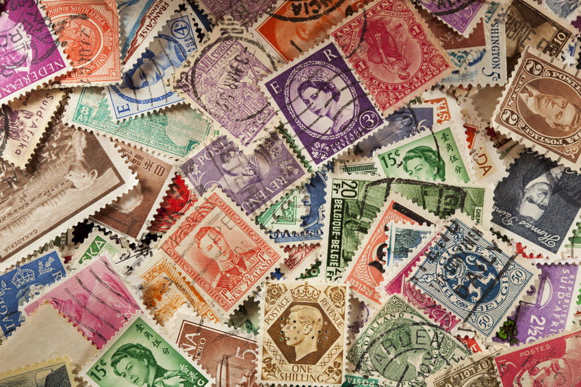 Stamp collector examining rare stamps